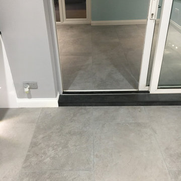 J pull handle Kitchen with compact laminate and porcelain floor tiles
