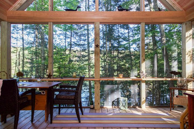 Trendy screened-in porch photo in Burlington