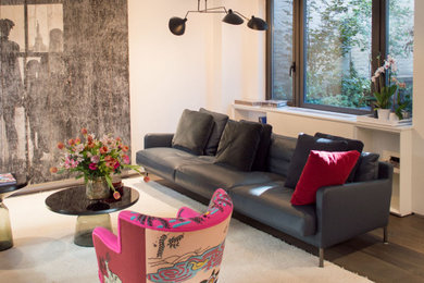 Example of a small minimalist open concept dark wood floor living room design in New York with white walls
