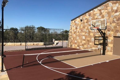 Inspiration for a mid-sized traditional full sun backyard outdoor basketball/tennis/multi-game court in Austin for summer.