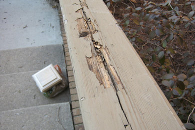Old split and rotted porch railing