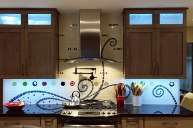 Eat-in kitchen - mid-sized eat-in kitchen idea in St Louis with granite countertops, stainless steel appliances and an island