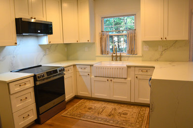 Cottage kitchen photo in Richmond with shaker cabinets, quartz countertops and quartz backsplash