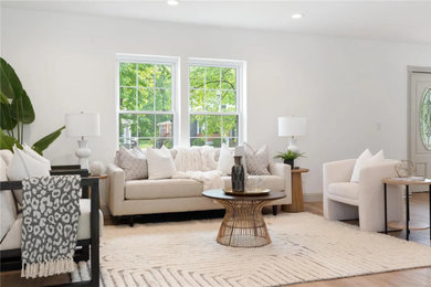 Example of a farmhouse living room design in St Louis