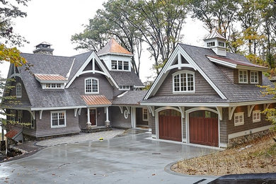 Large craftsman gray two-story wood exterior home idea in Grand Rapids