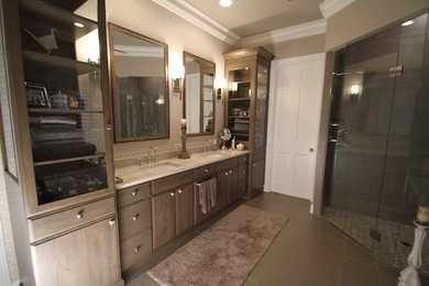 Corner shower - mid-sized traditional master corner shower idea in Other with flat-panel cabinets, medium tone wood cabinets, beige walls, an undermount sink, marble countertops and a hinged shower door
