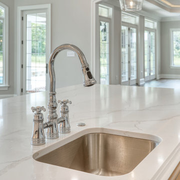 Transitional Kitchen with Two Toned Gathering Island & Archways