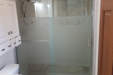 Sliding glass shower elclosure with tower bar inside and c-pull outside