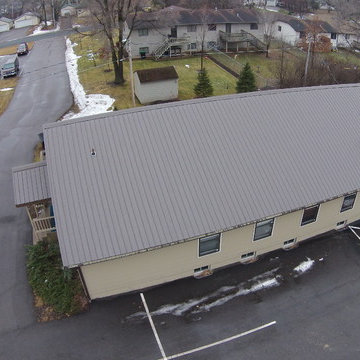 Metal roof and seamless gutters on a Church building