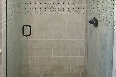 Bathroom - small modern 3/4 gray tile and porcelain tile bathroom idea in New York with marble countertops and gray countertops