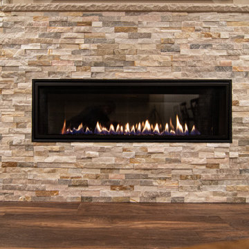 Basement Showing Warm Colors, Straight Lined Cabinets and Stacked Stone