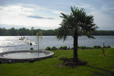 Example of an island style home design design in Montreal