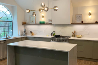 Example of an eat-in kitchen design in Austin with an undermount sink, flat-panel cabinets, gray cabinets, quartzite countertops, white backsplash, an island and white countertops