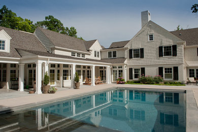 Pool - mid-sized transitional courtyard stone and rectangular pool idea in Oklahoma City