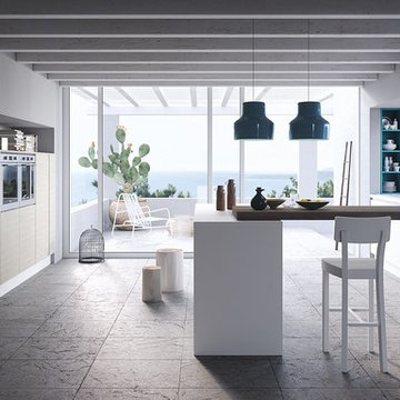 Modern white and light wood kitchen with wood table top