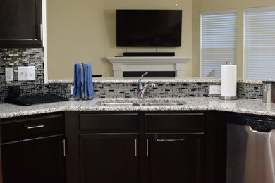 Kitchen - contemporary kitchen idea in Las Vegas with a double-bowl sink, multicolored backsplash and mosaic tile backsplash