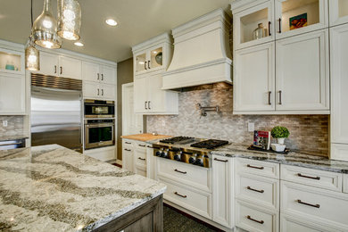 Example of a transitional kitchen design in Denver