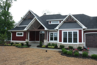 Large transitional red two-story mixed siding exterior home photo in Indianapolis