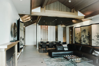 Inspiration for a large modern formal enclosed living room in Seattle with grey walls, light hardwood floors, a standard fireplace, a metal fireplace surround and no tv.