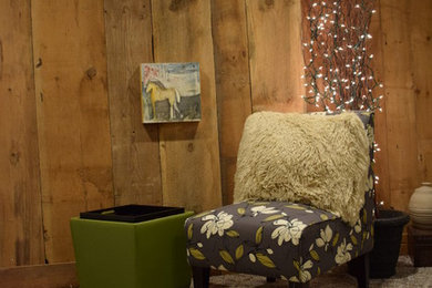 Example of a mountain style underground carpeted basement design in Chicago with brown walls