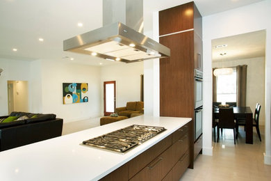 Photo of a contemporary open plan kitchen in Dallas with flat-panel cabinets and dark wood cabinets.