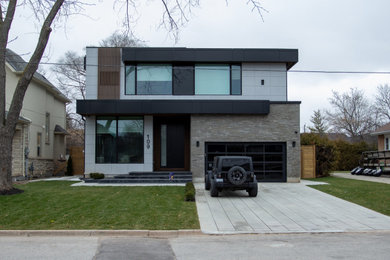 Foto de fachada de casa gris contemporánea grande de dos plantas con revestimiento de estuco y tejado plano