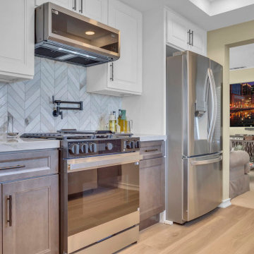 Stylish Cooking Zone with Chevron Marble and Warm Wood Tones