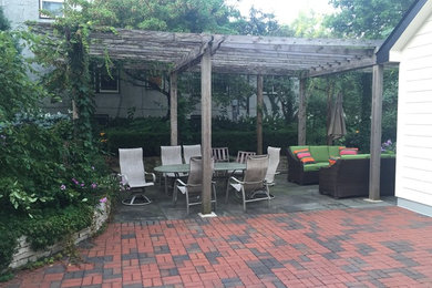 This is an example of a large traditional partial sun backyard stone landscaping in Minneapolis for summer.