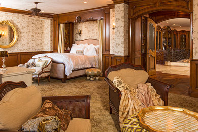 Example of a large classic master carpeted bedroom design in Santa Barbara with a standard fireplace