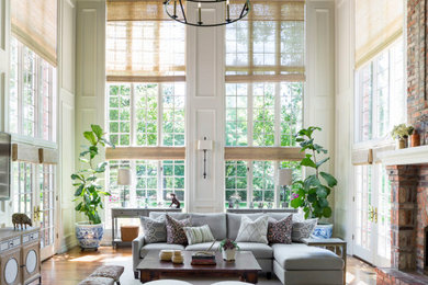 Example of a transitional sunroom design in Denver