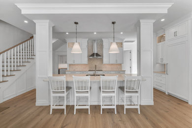 Inspiration for a coastal kitchen remodel in Miami with white cabinets