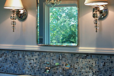 Inspiration for a large transitional master blue tile and mosaic tile porcelain tile freestanding bathtub remodel in Other with a vessel sink, furniture-like cabinets, dark wood cabinets, wood countertops, a one-piece toilet and blue walls