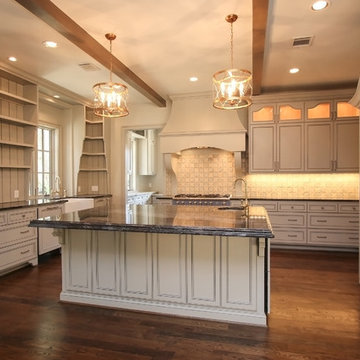 Combining Stucco and Stone bring charm to this Country French