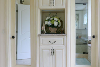 Inspiration for a timeless bathroom remodel in Los Angeles with a one-piece toilet and an integrated sink