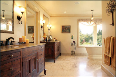 Large traditional master bathroom in Portland with an undermount sink, furniture-like cabinets, dark wood cabinets, granite benchtops, a freestanding tub, a two-piece toilet, brown tile, porcelain tile, yellow walls, an alcove shower, yellow floor and a hinged shower door.
