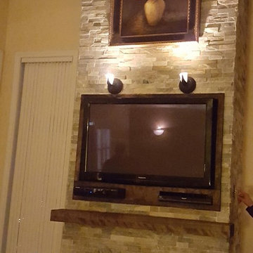 Fireplace remodle with built in entertainment unit and floating mantle