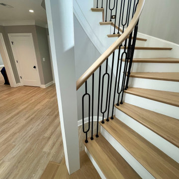 Project #95 | Freestanding Elliptical Staircase with Geometric Iron Balusters