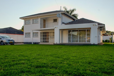 Inspiration for a mid-sized contemporary exterior home remodel in Other