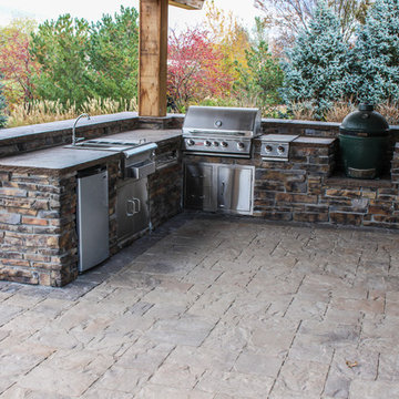 Elegant Stone Paver Patio and Robust Outdoor Kitchen Set