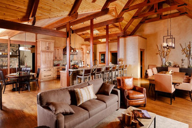 Inspiration for a rustic dark wood floor kitchen/dining room combo remodel in Other with multicolored walls