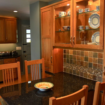 Cohesive Transitional Kitchen | Cherry Cabinets & Black Granite Table