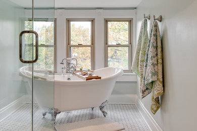 Large contemporary master bathroom in Columbus with an undermount sink, raised-panel cabinets, dark wood cabinets, wood benchtops, a claw-foot tub, a double shower, a two-piece toilet, white tile, stone tile, grey walls and marble floors.