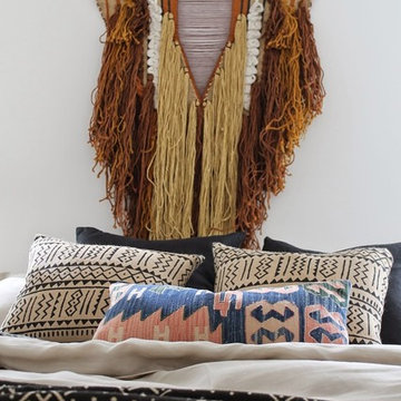Modern Tonal Bedroom with African Mudcloth and Sheepskin Rug