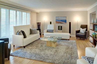 Inspiration for a light wood floor living room remodel in Toronto with gray walls and no fireplace