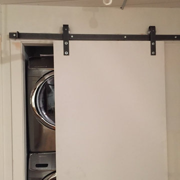 Laundry closet with barn/industrial sliding doors/hinges