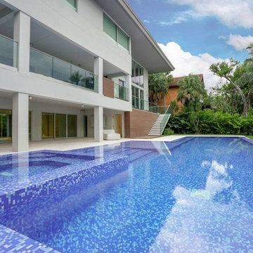 Modern pool with custom blue recycled glass mosaic mix