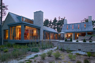 Large modern gray one-story stone gable roof idea in Toronto