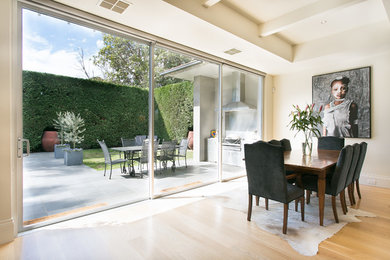 Photo of a transitional dining room in Melbourne.