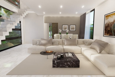 Modelo de salón abierto y gris y blanco de tamaño medio con paredes blancas, chimenea de esquina, marco de chimenea de piedra, pared multimedia y suelo blanco