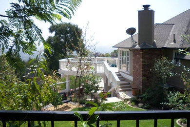 Design ideas for a large traditional backyard formal garden in Los Angeles.